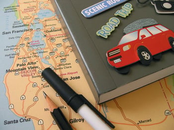Map of California along with a pen, pencil, and notebook with stickers